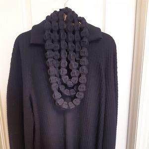 Chanel Sweater with a necklace
